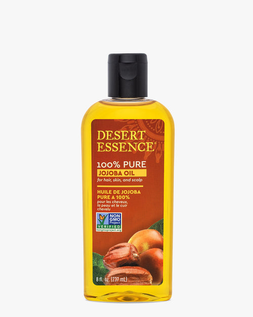 Desert Essence 100% Pure Jojoba Oil, 8 Fl Oz Value Size bottle featuring golden-colored oil in clear plastic container with black cap. Label shows jojoba nuts and displays Non-GMO verification badge on orange background.