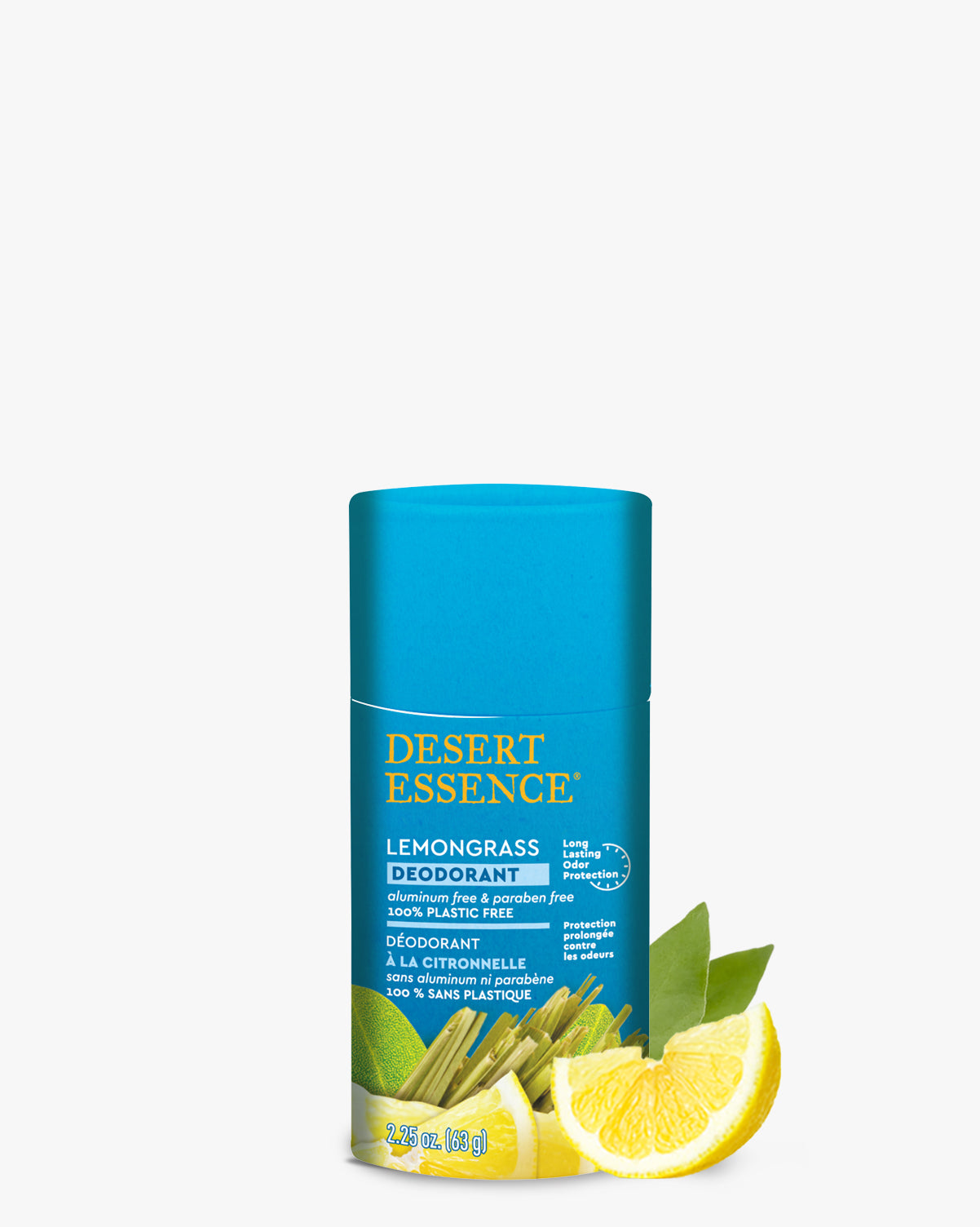 Lemongrass Deodorant in a bright turquoise eco-friendly paper tube with Desert Essence branding, displayed alongside fresh lemon slices and green leaves against a white background