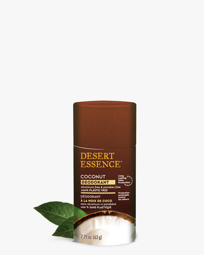 Desert Essence Coconut Deodorant in eco-friendly brown paperboard tube with natural ingredients, featuring coconut and green leaf decoration. Product stands against white background showcasing natural and sustainable packaging design.