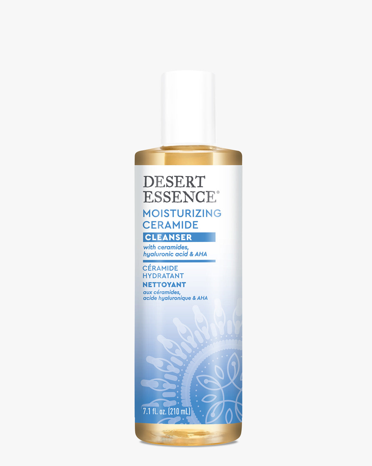 Desert Essence Moisturizing Ceramide Cleanser bottle with golden liquid formula and white cap, featuring blue label design with mandala pattern, containing ceramides and hyaluronic acid for gentle facial cleansing.