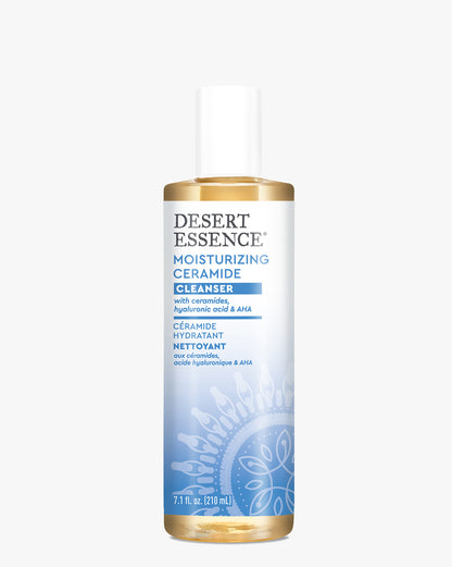 Desert Essence Moisturizing Ceramide Cleanser bottle with golden liquid formula and white cap, featuring blue label design with mandala pattern, containing ceramides and hyaluronic acid for gentle facial cleansing.