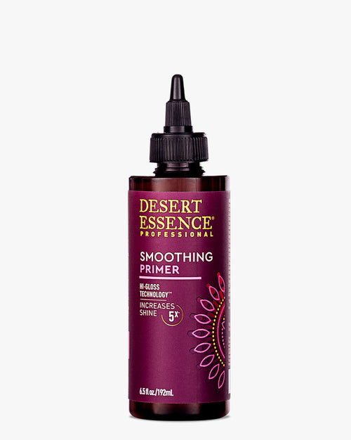 Desert Essence Smoothing Hair Primer in a dark purple bottle with precision dropper applicator, featuring Hi-Gloss Technology and natural ingredients for 5X shine increase, displayed against white background.