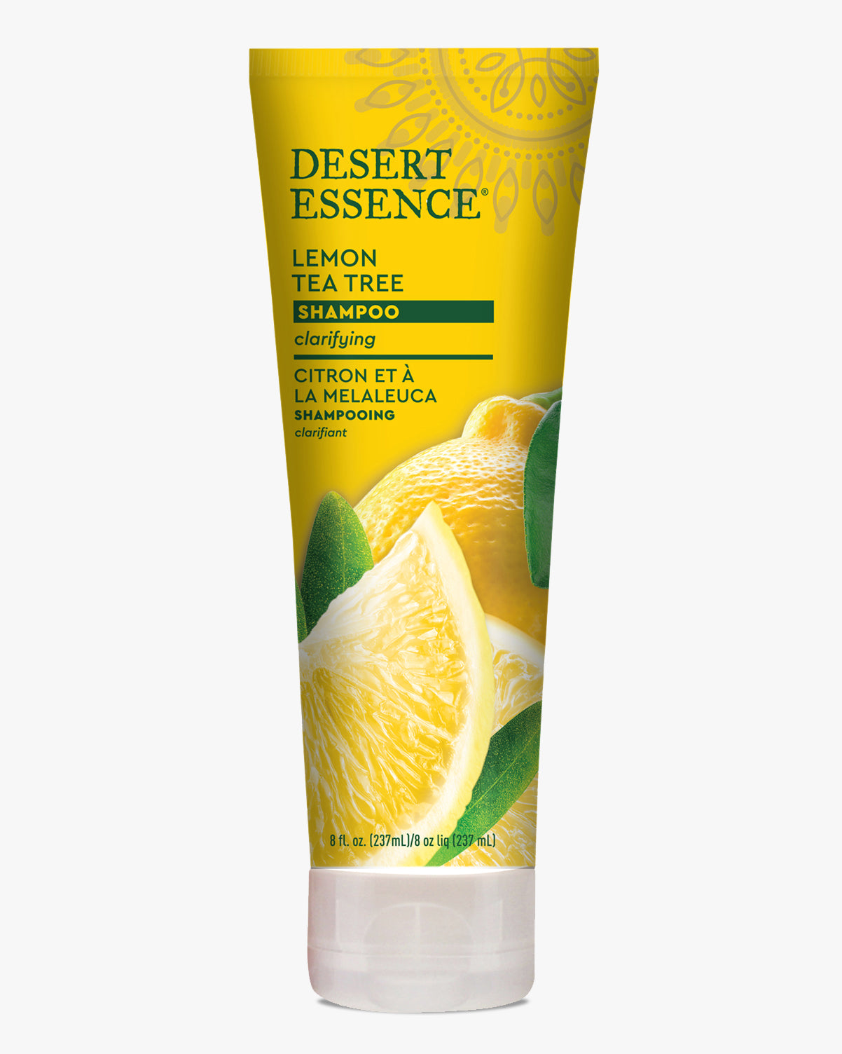 Desert Essence Lemon Tea Tree Shampoo bottle in bright yellow packaging featuring fresh lemon slices and green leaves, with clarifying formula text and organic ingredients displayed on a clean white background