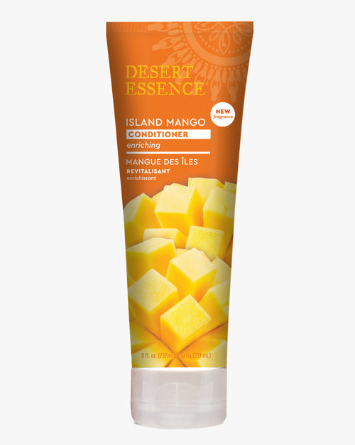 Desert Essence Island Mango Conditioner tube featuring vibrant orange packaging with yellow mango cubes design, showcasing natural hair care product with tropical ingredients for enriching hair treatment