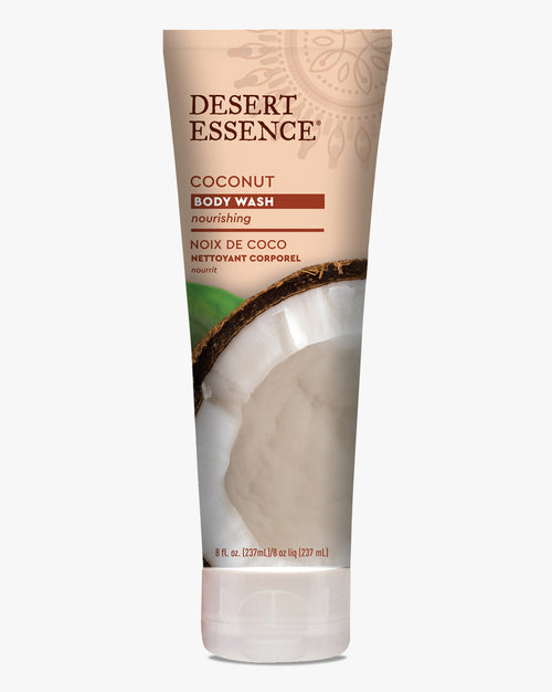 Desert Essence Coconut Body Wash tube featuring fresh coconut imagery on beige packaging, displaying nourishing body cleanser with bilingual text in English and French