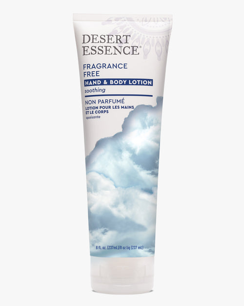 Desert Essence Fragrance Free Hand and Body Lotion tube with calming sky-blue cloud design against white background, featuring bilingual English and French text and soothing aesthetic for sensitive skin care