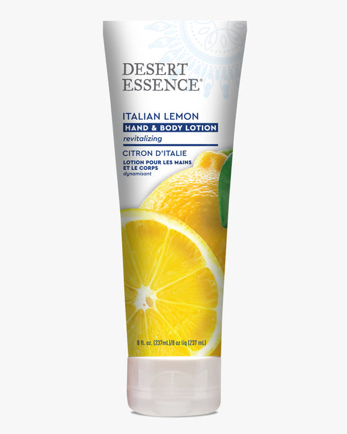 Desert Essence Italian Lemon Hand & Body Lotion tube featuring vibrant yellow sliced lemon imagery on white packaging, with blue and gray text detailing the revitalizing formula in both English and French.