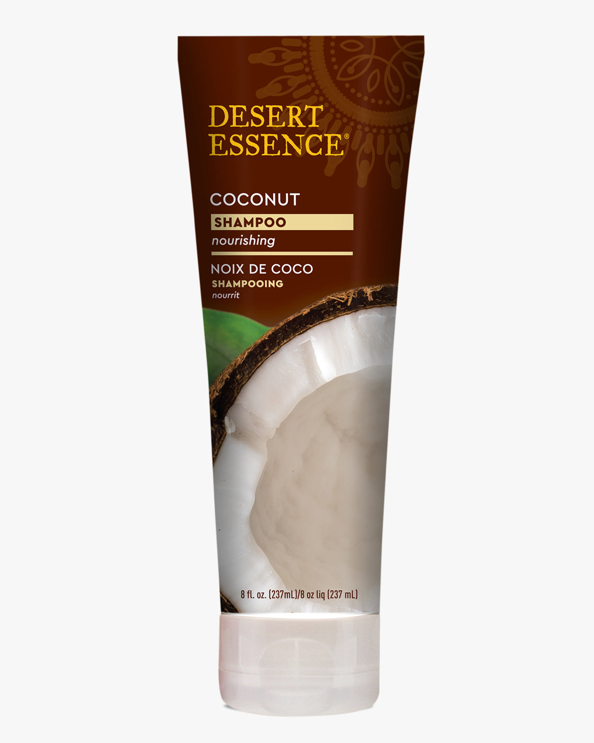 Desert Essence Coconut Shampoo tube with brown and gold packaging featuring a fresh coconut visual, designed for nourishing dry hair with organic ingredients and natural moisturizers