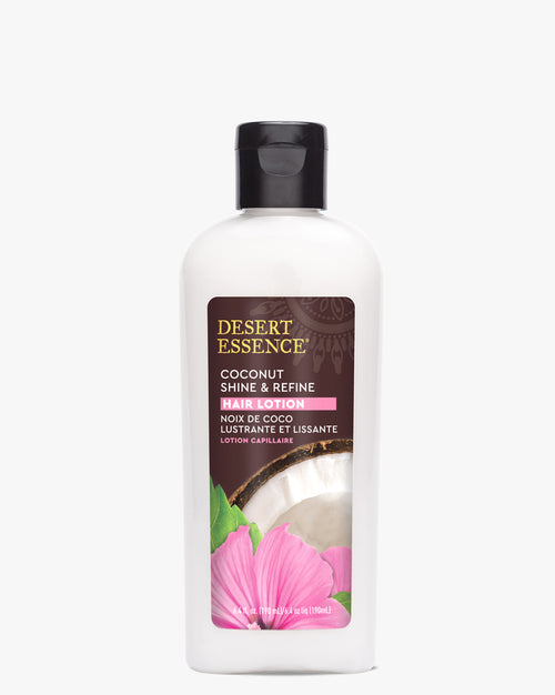 Desert Essence Coconut Shine & Refine Hair Lotion bottle with pink tropical flower and coconut imagery on white label, featuring black cap and clear plastic container displaying silicone-free hair treatment formula