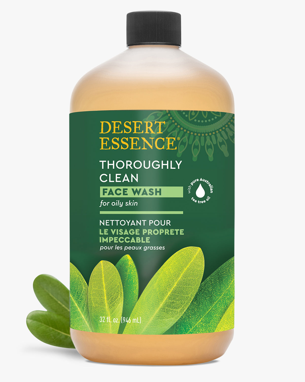 Desert Essence Thoroughly Clean Face Wash Refill bottle featuring amber-colored liquid in clear plastic container with green label, decorated with leaf motifs. Natural face cleanser for oily skin with Tea Tree Oil and Castile Soap, 32 fl oz size.